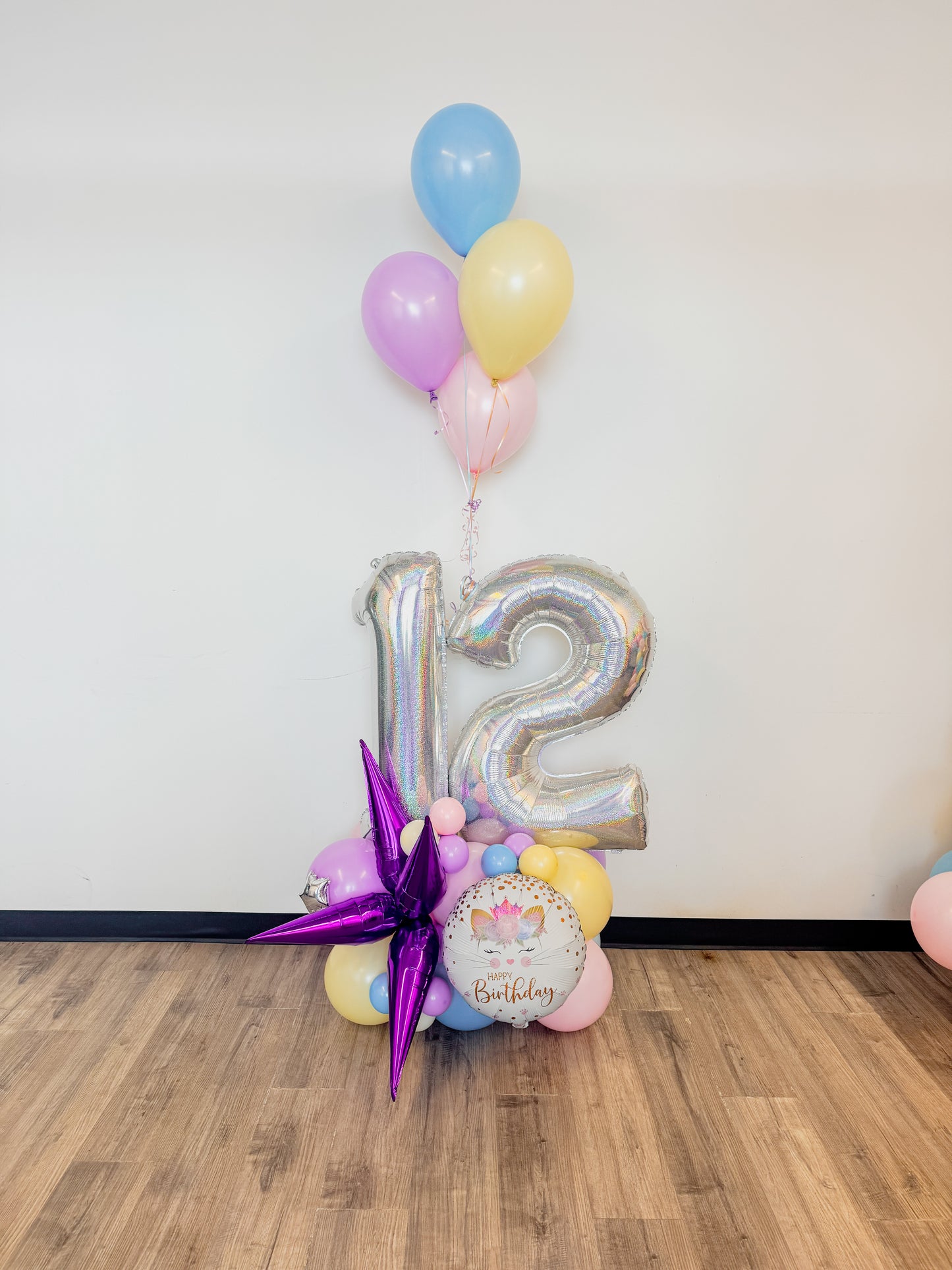 Aged balloon display with helium