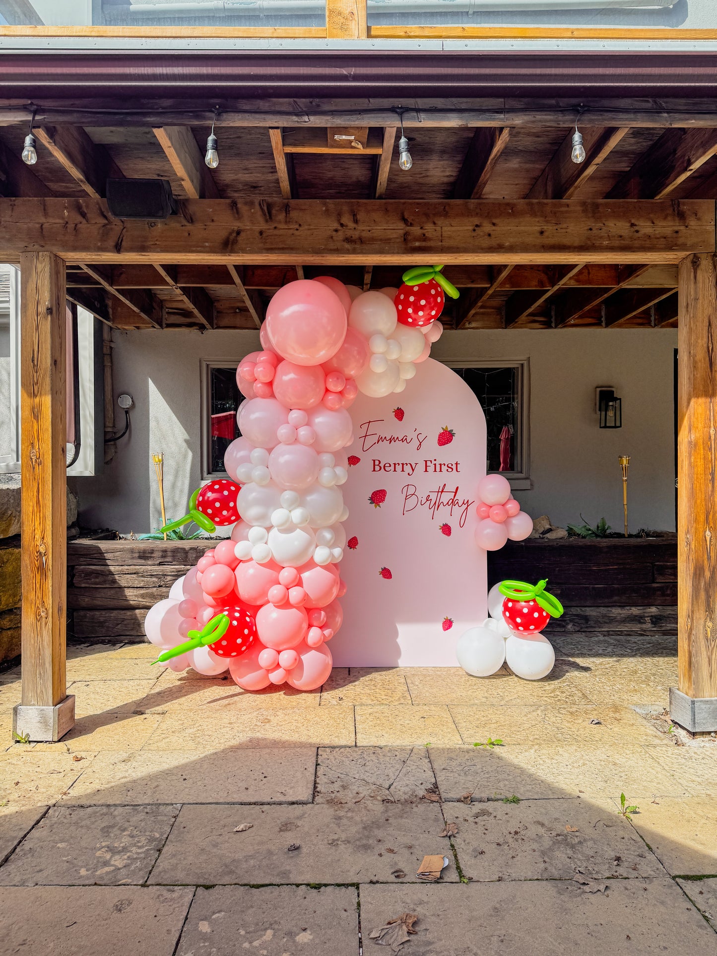 Berry first birthday large solid balloon backdrop.