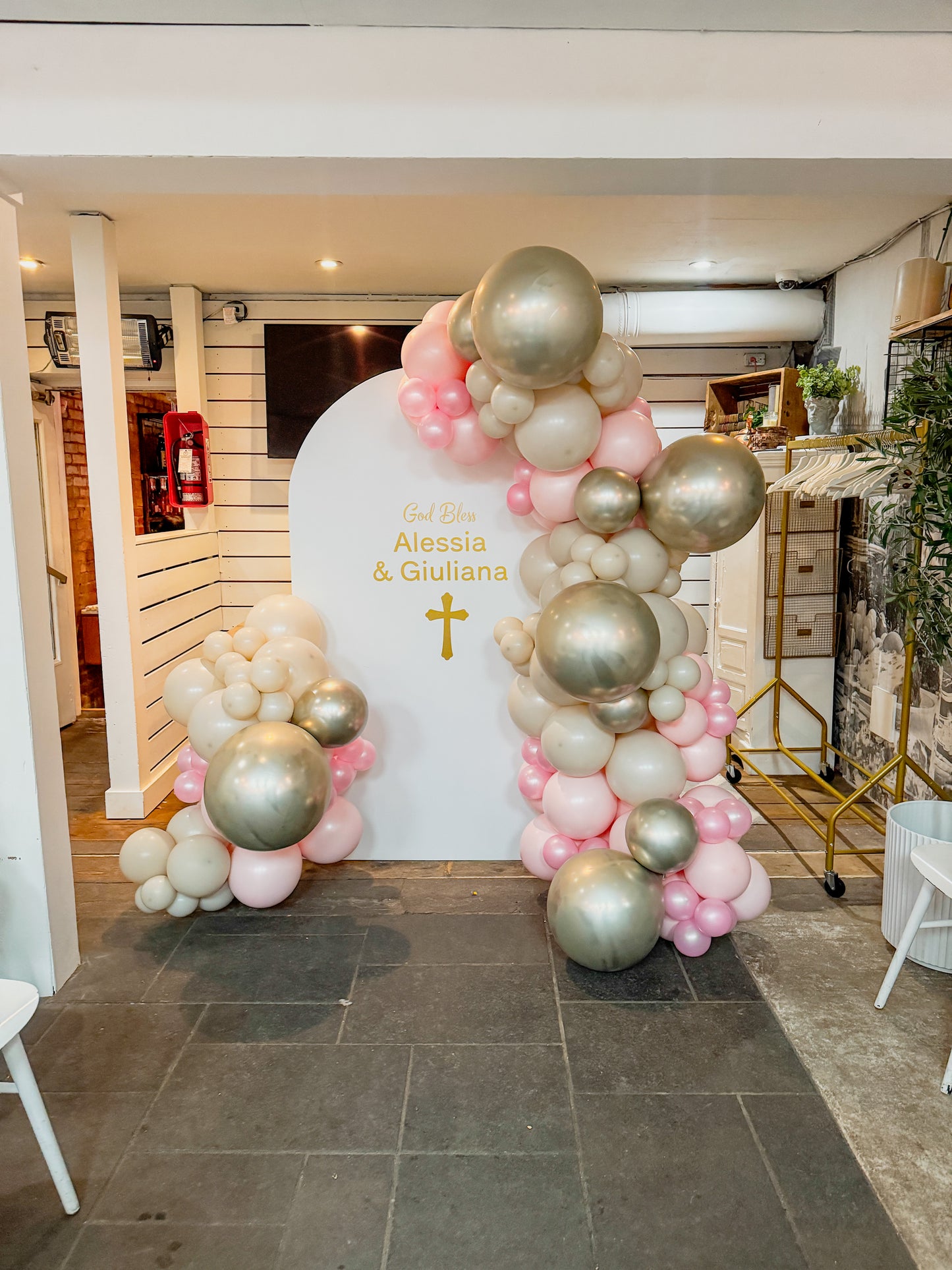 Large solid backdrop filled with balloons