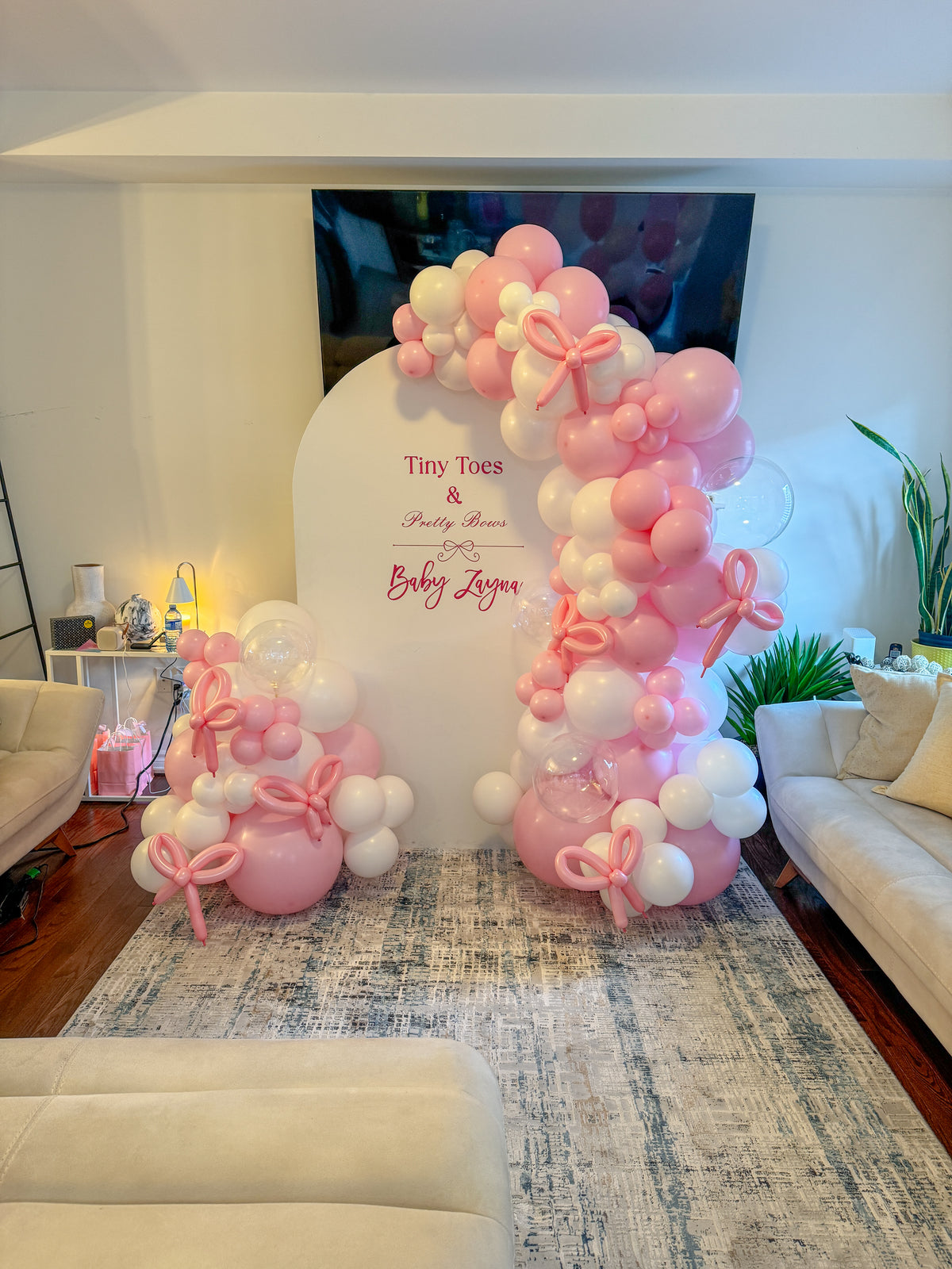 Large solid bow themed balloons backdrop