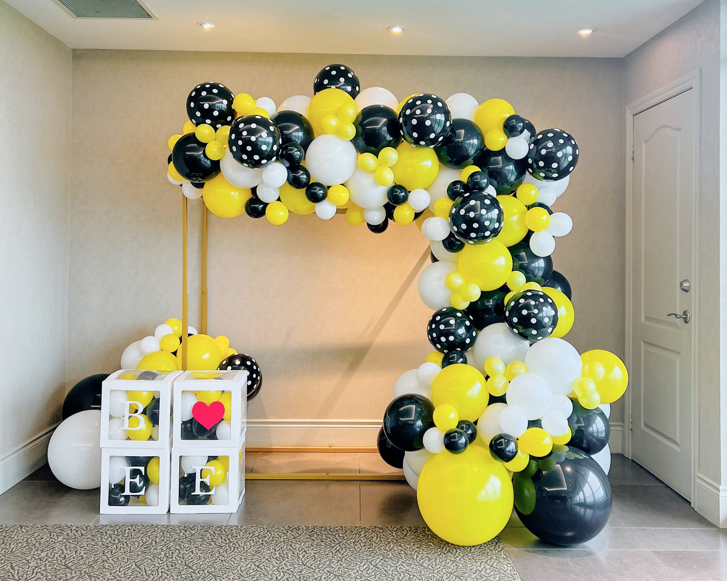 5 foot tall square gold arch with balloons & Baby Boxes