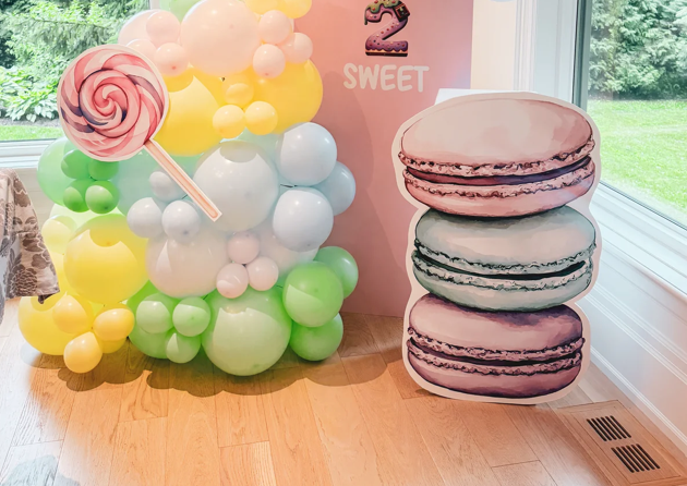 Double solid backdrop with cake stand and cutout