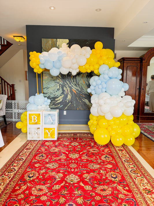 5 foot tall square gold arch with balloons & Baby Boxes