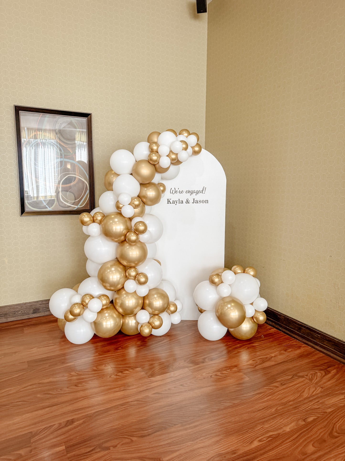Middle solid balloon backdrop with balloons on both sides