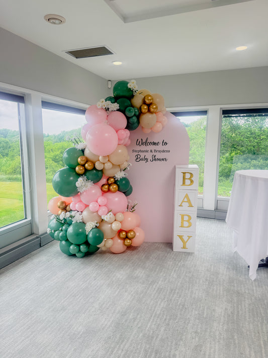 Large floral accented balloon display with baby boxes