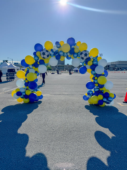 Large walk through themed full balloon arch