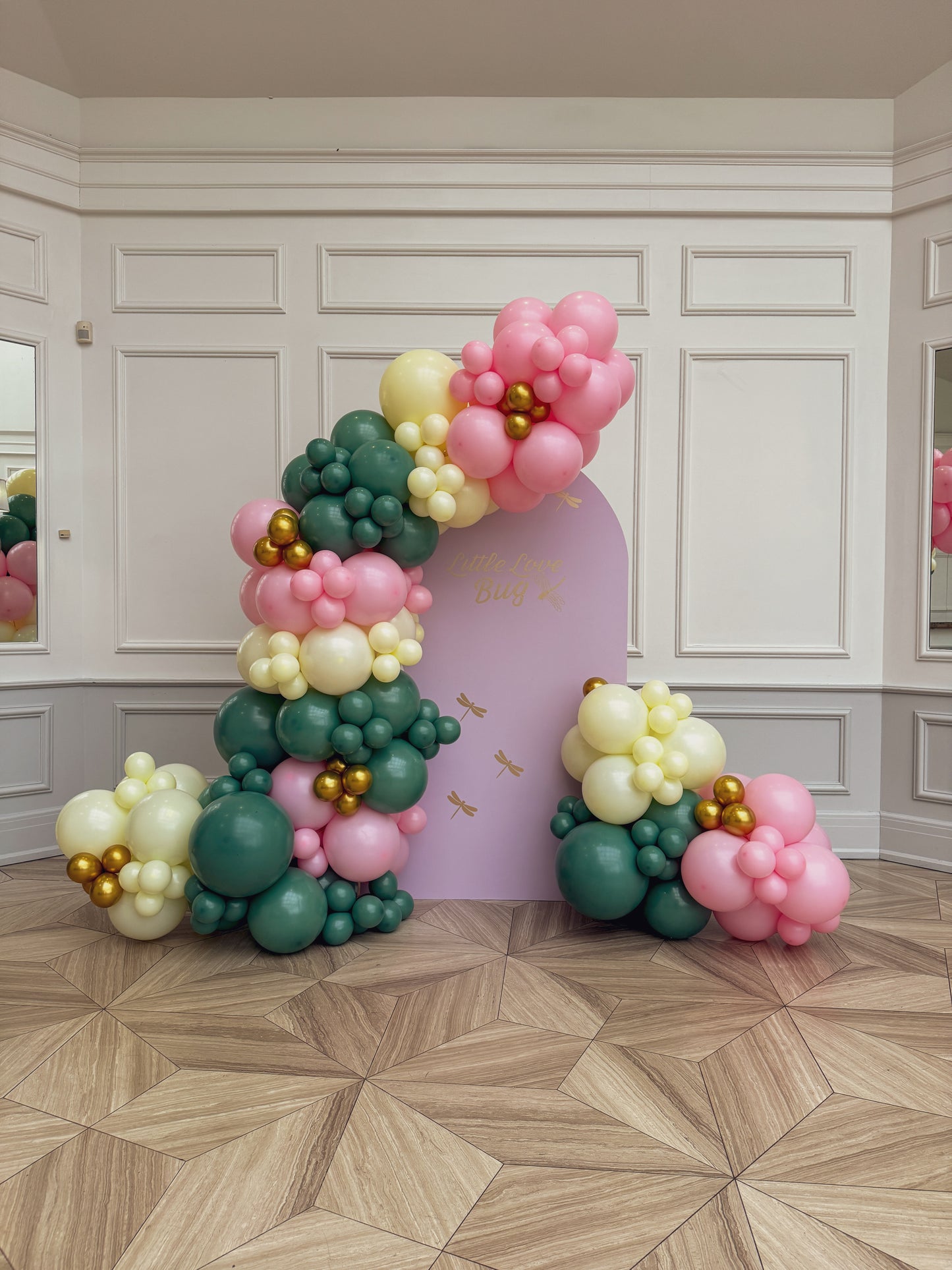 Large solid backdrop with lush balloons