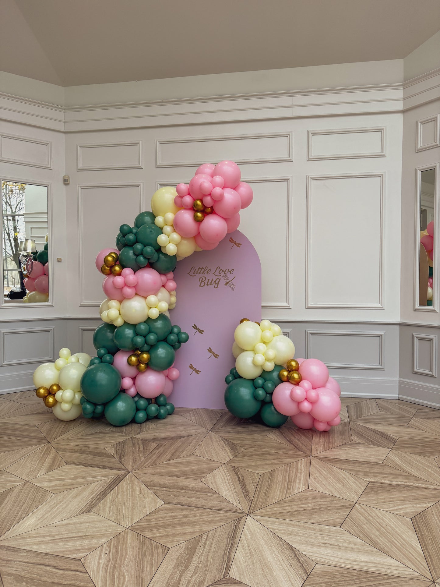 Large solid backdrop with lush balloons