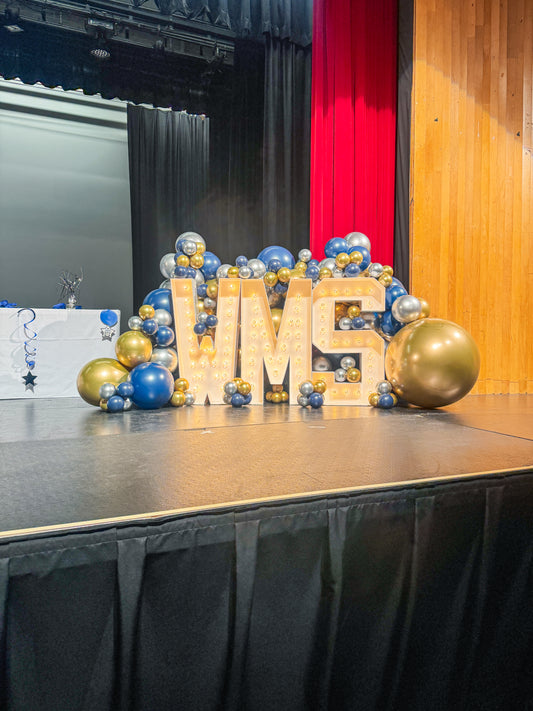 Light up letters with surrounding balloon garland