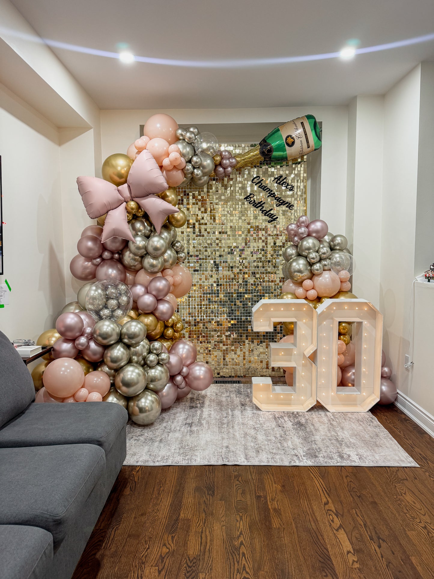 8 foot tall shimmer wall with lush balloons, foils and two light up numbers