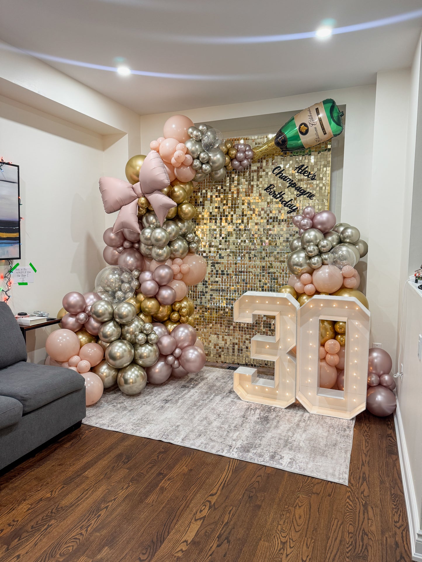 8 foot tall shimmer wall with lush balloons, foils and two light up numbers