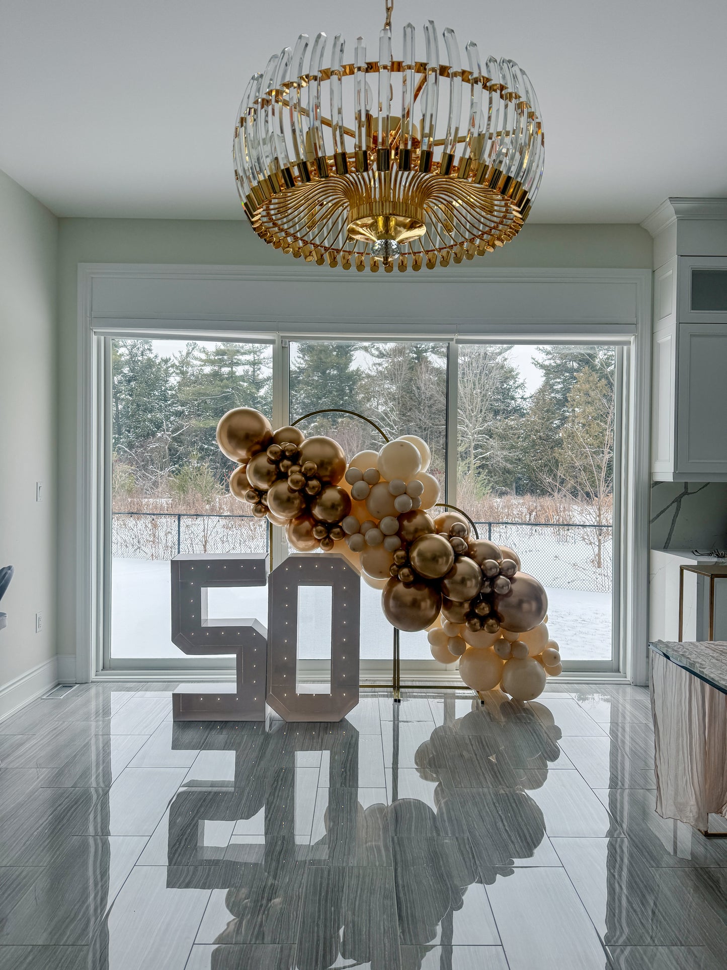 Double gold arch stand with 7 foot balloon garland & two light up numbers