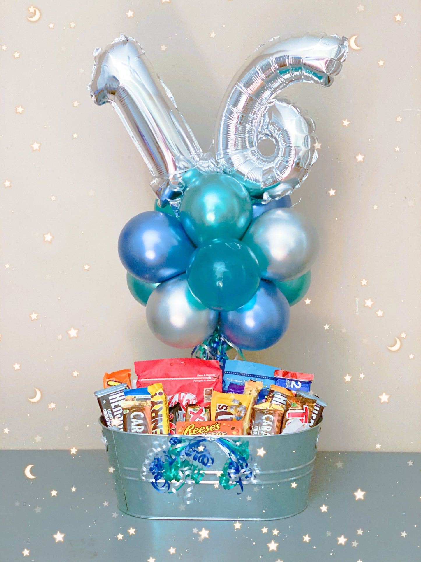 Number foil balloons with a large chocolate bar basket