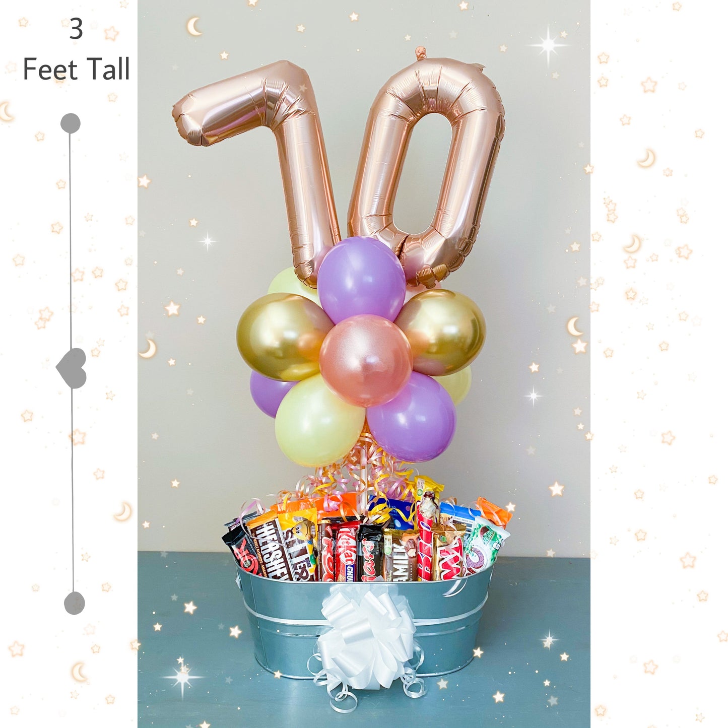 Number foil balloons with a large chocolate bar basket