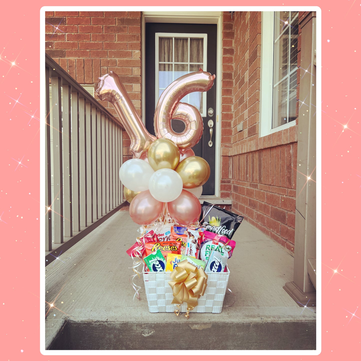 Number foil balloons with a large chocolate bar basket